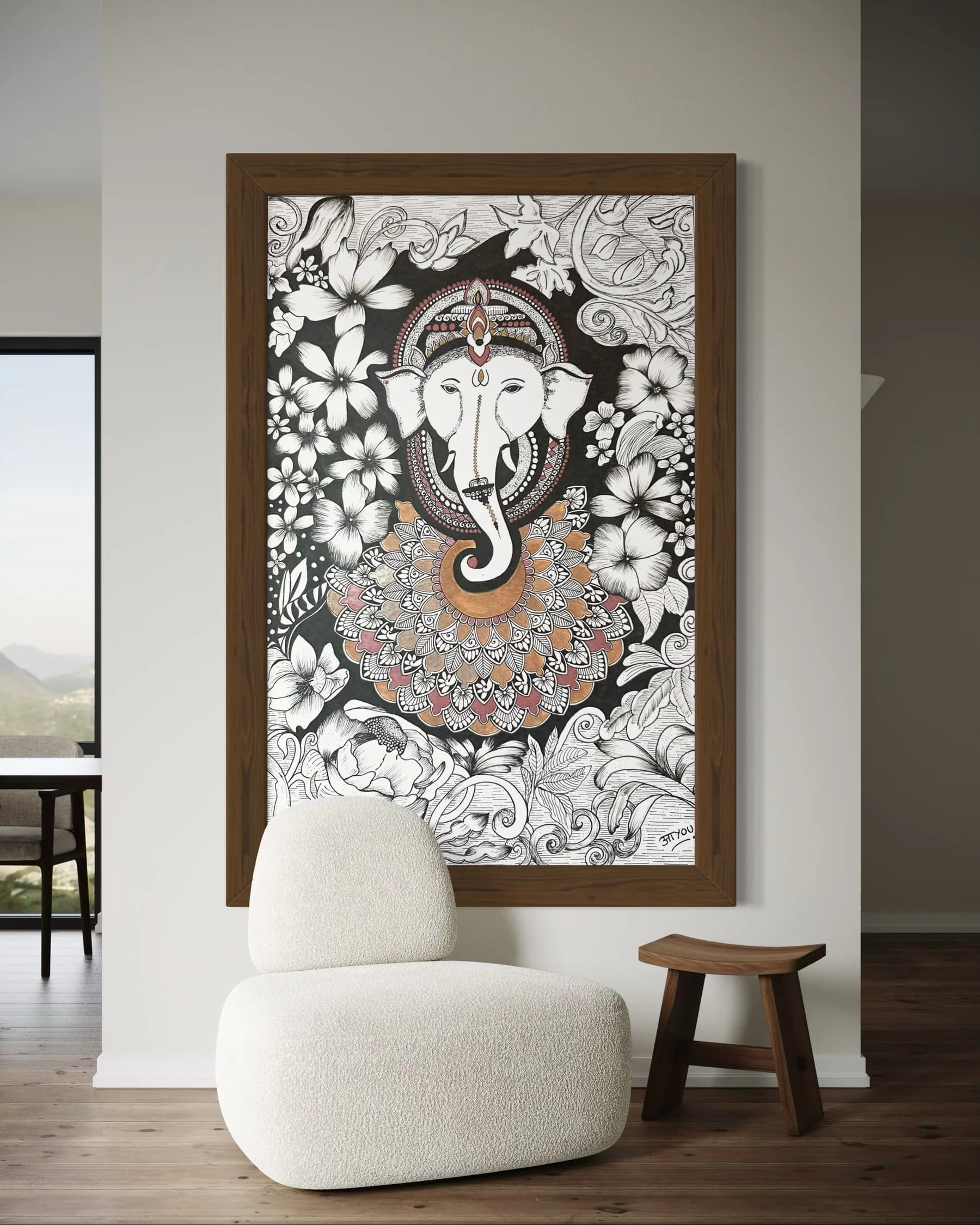 Ganesha’s face in white line work among black and white flowers, above a copper and rose mandala, in a wooden frame