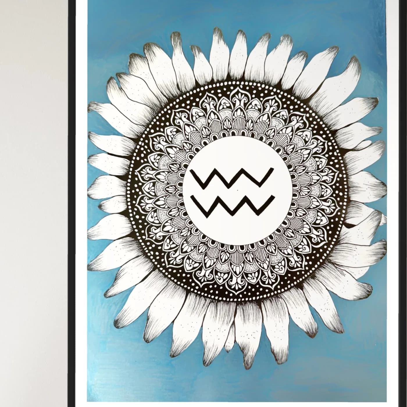Aquarius sign in a sunflower mandala on a blue background